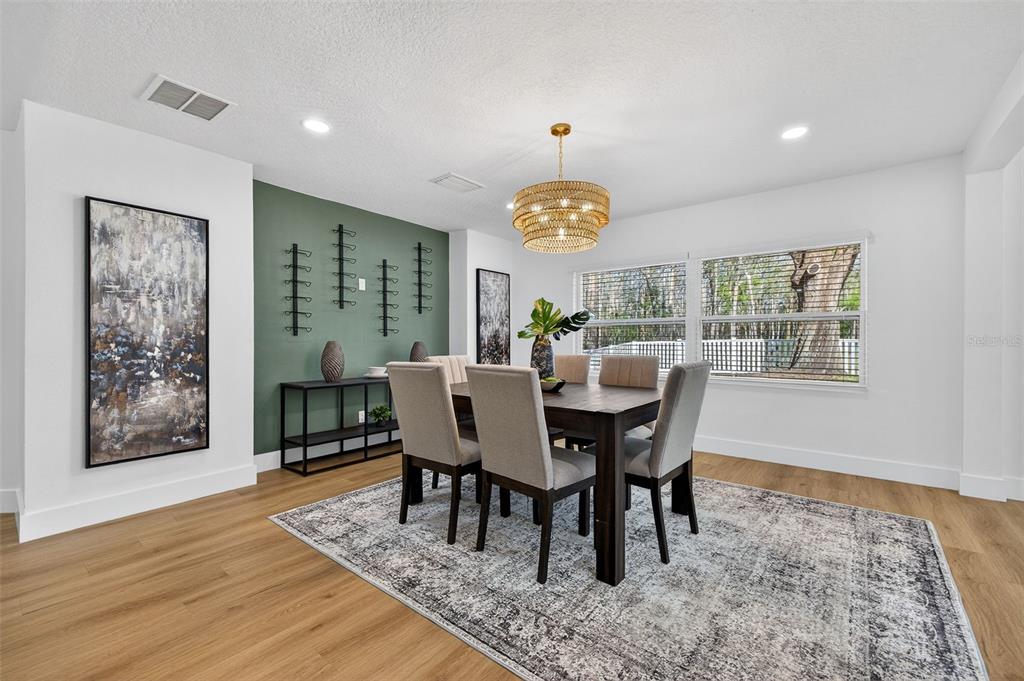 1120 Country Lane Lutz, FL 33558 - Photo 21 of 52 a view of a dining room with furniture and wooden floor