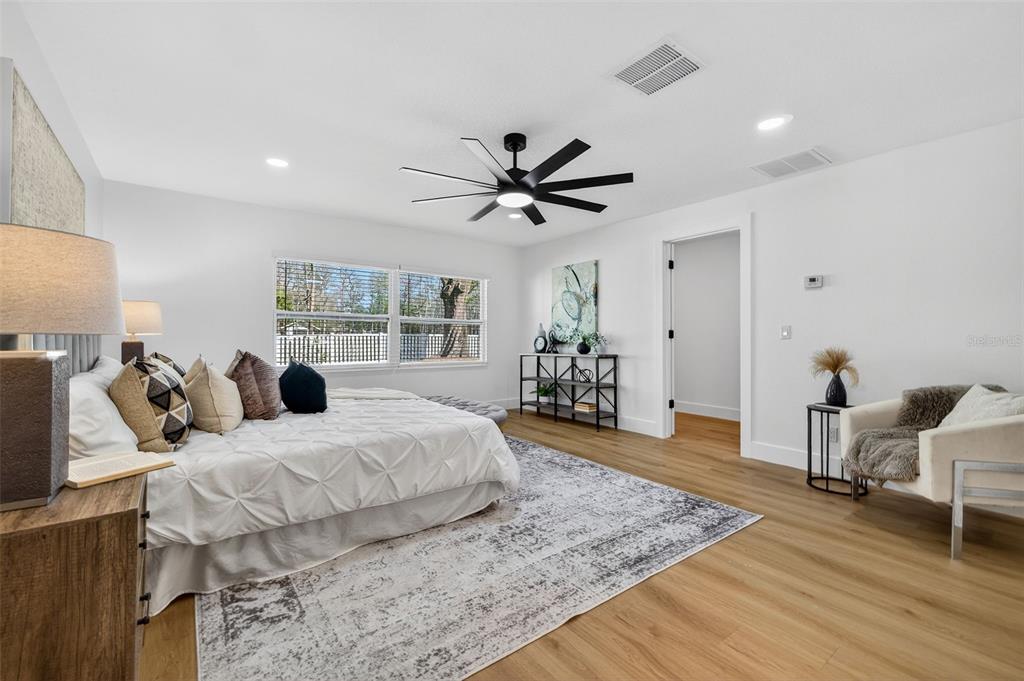 1120 Country Lane Lutz, FL 33558 - Photo 25 of 52 a bedroom with a bed and window