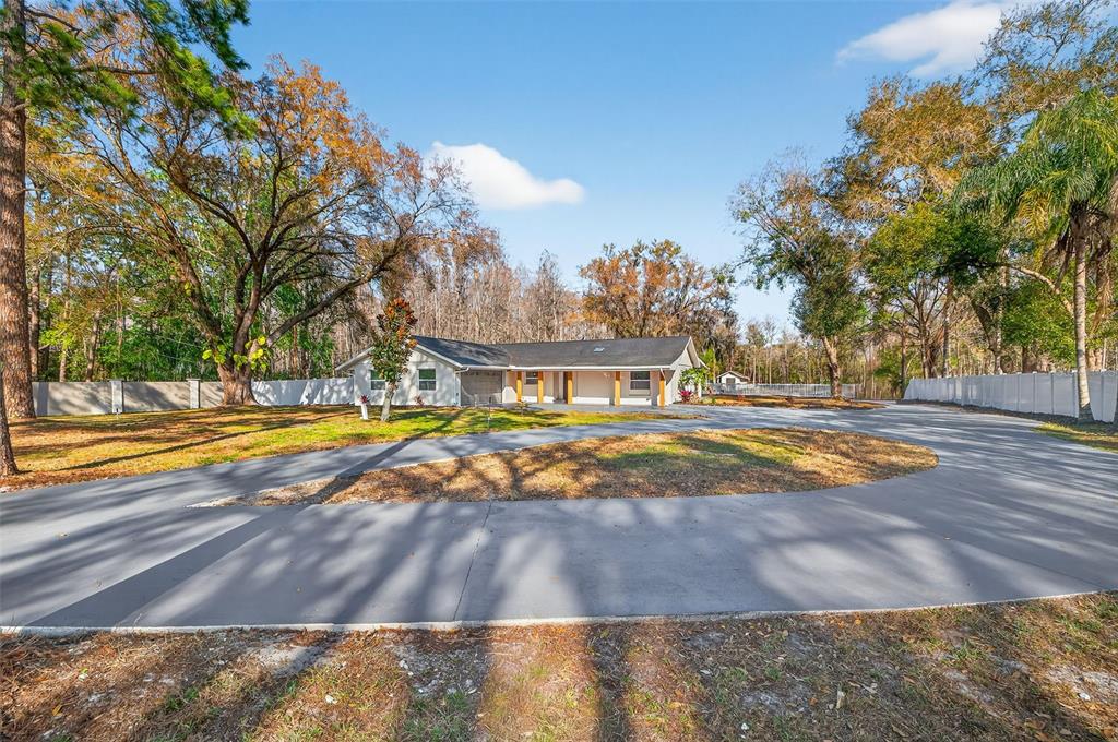 1120 Country Lane Lutz, FL 33558 - Photo 4 of 52 a view of swimming pool with an outdoor space
