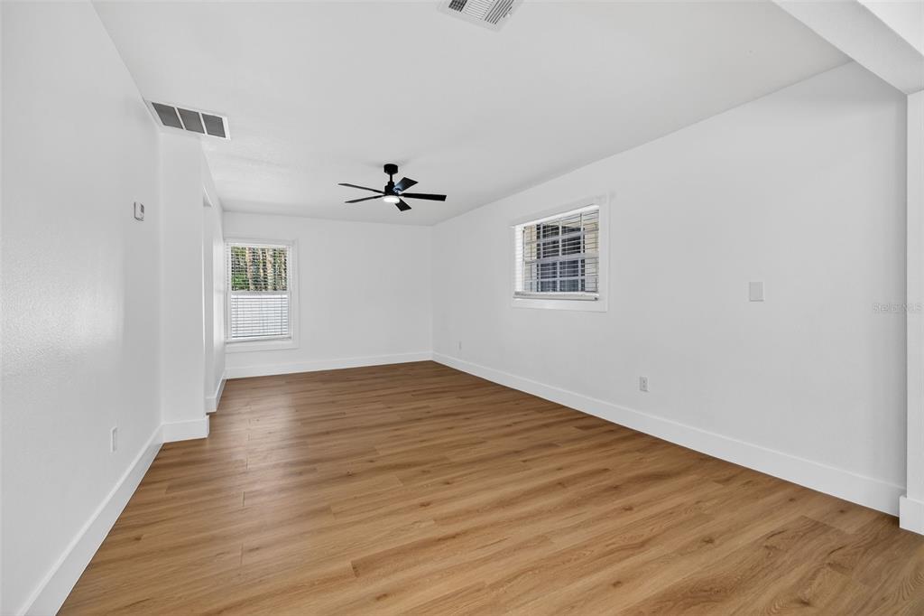 1120 Country Lane Lutz, FL 33558 - Photo 41 of 52 a view of empty room with wooden floor
