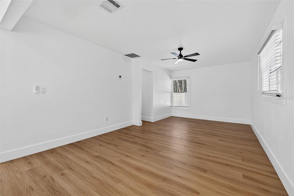 1120 Country Lane Lutz, FL 33558 - Photo 42 of 52 wooden floor in an empty room with a window