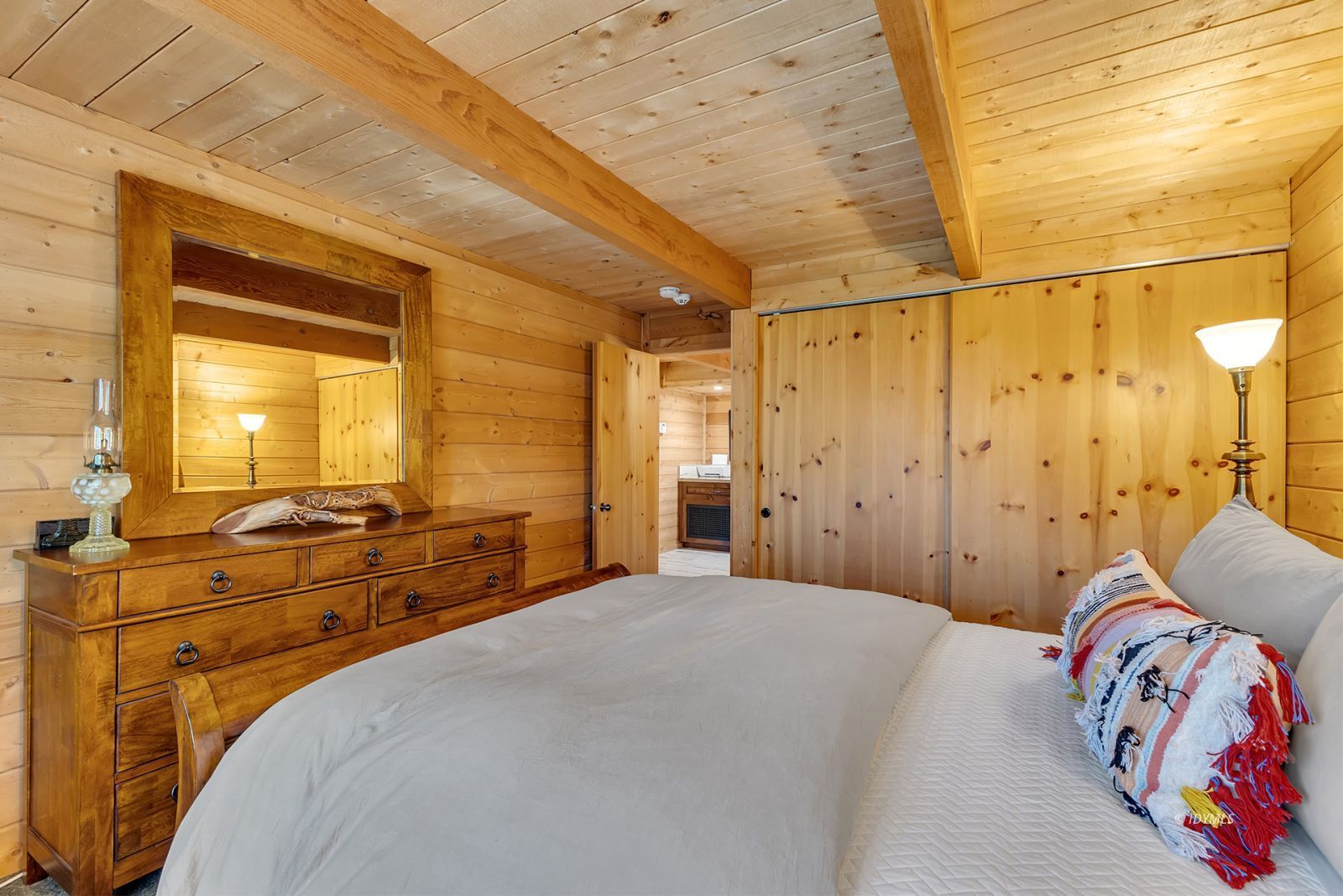 24924 Fern Valley Road Idyllwild, CA 92549 - Photo 39 of 72 a bedroom with a bed and wooden floor