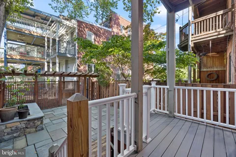 a view of a brick house with large windows