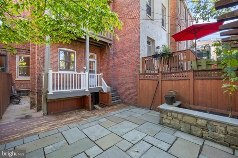 a view of a chair and table in the balcony