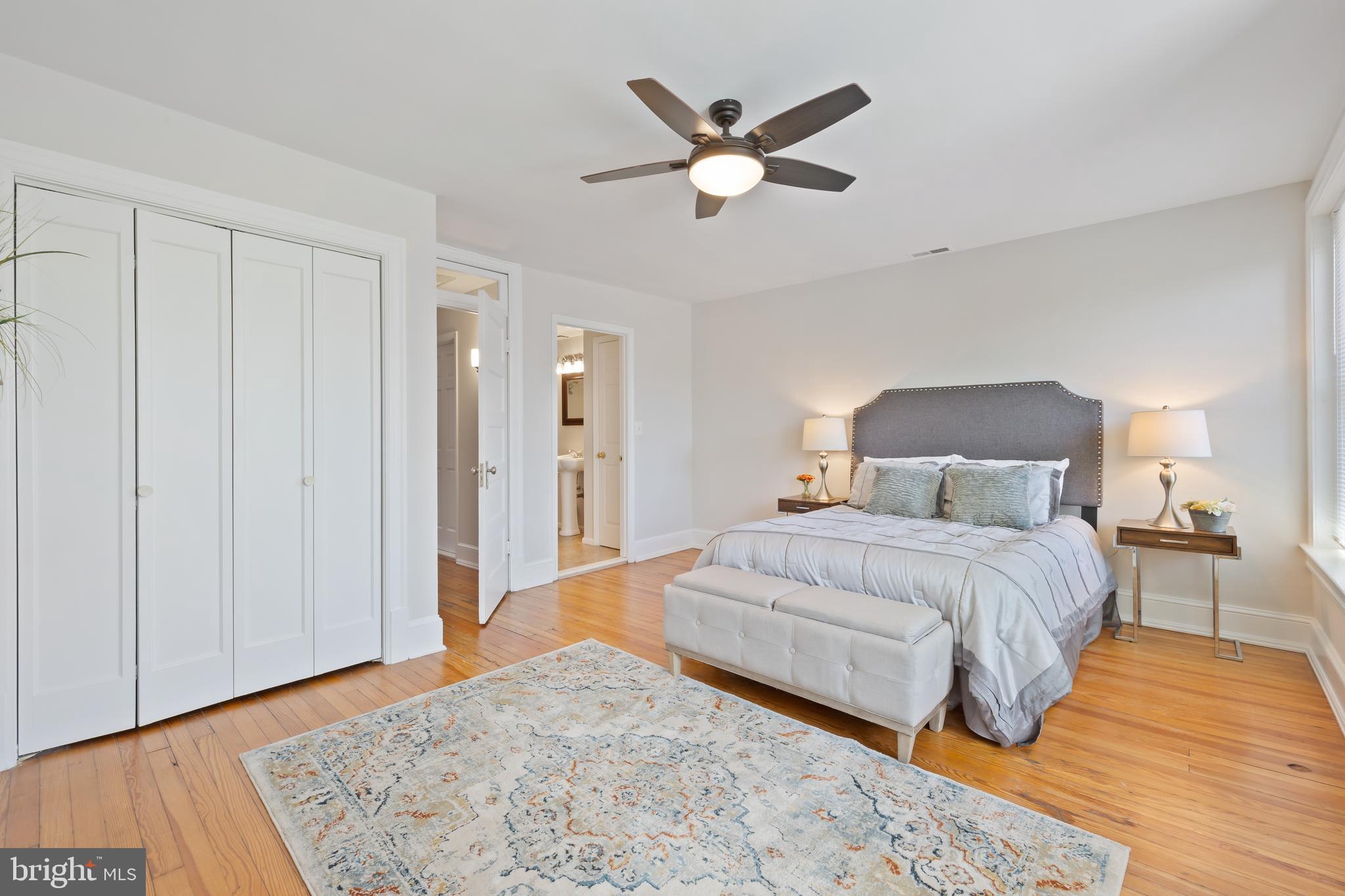 2724 13th Street Northwest Washington, DC 20009 - Photo 19 of 49 a bedroom with a large bed and a chandelier