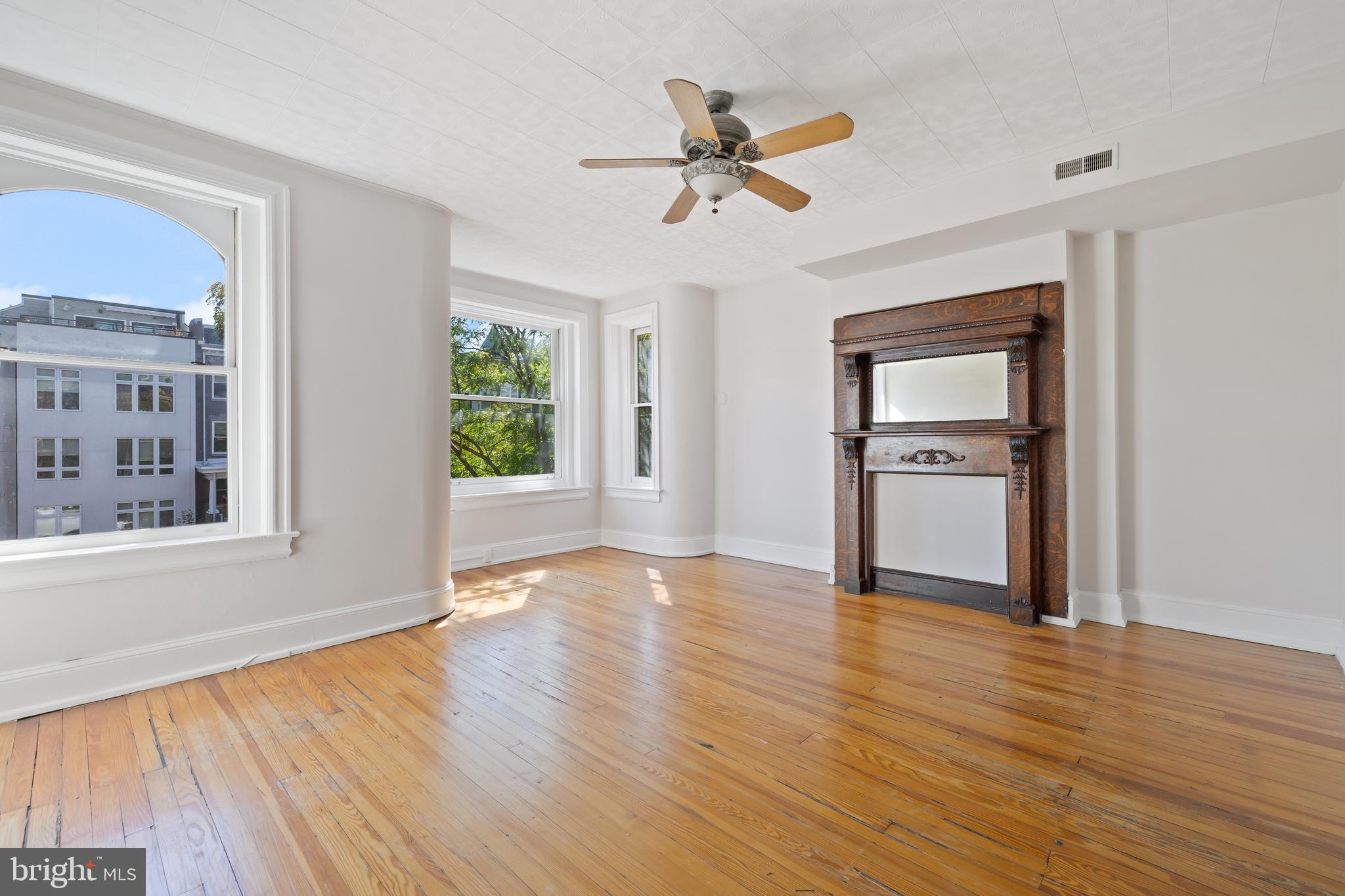 2724 13th Street Northwest Washington, DC 20009 - Photo 22 of 49 a view of empty room with wooden floor and fan