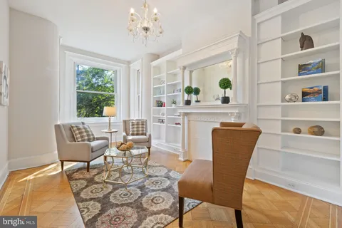 a view of a dining room with furniture and a window