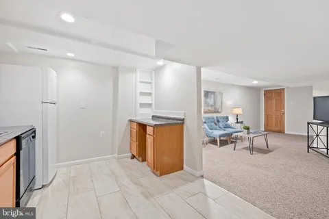 a kitchen with a stove and a refrigerator
