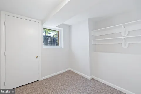 a bathroom with a sink mirror and a bathtub