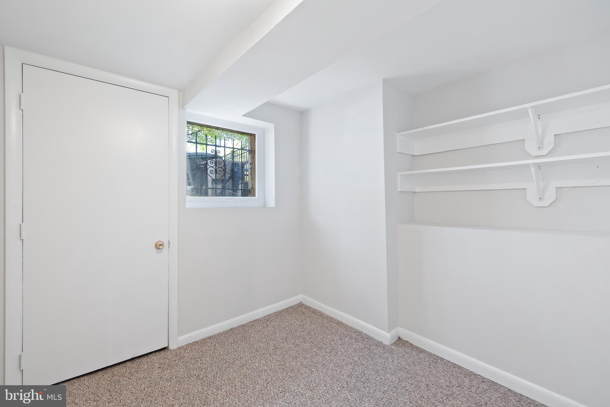 2724 13th Street Northwest Washington, DC 20009 - Photo 43 of 49 a view of an empty room with closet and a window