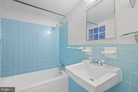 a view of storage and utility room with washer and dryer