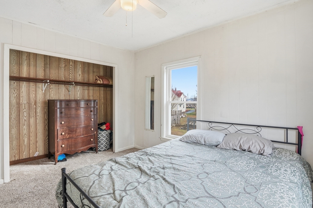 21 Whitman Street Leominster, MA 01453 - Photo 16 of 34 a bedroom with a bed and a large mirror