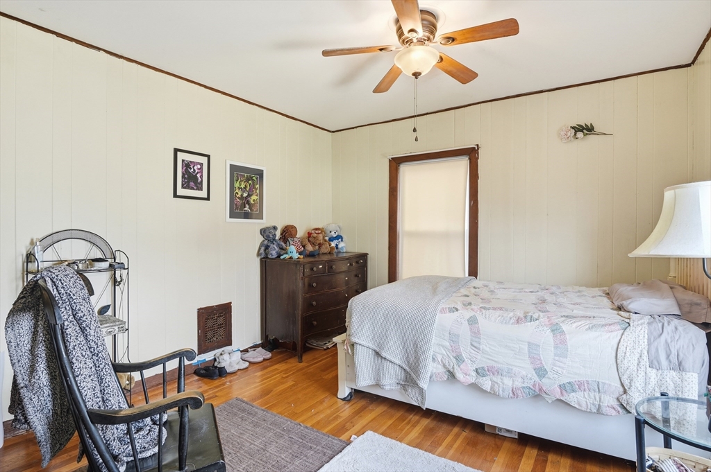 21 Whitman Street Leominster, MA 01453 - Photo 20 of 34 a bedroom with a bed a table and chair