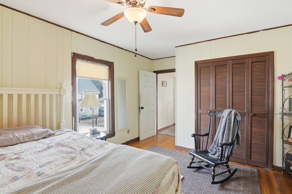 21 Whitman Street Leominster, MA 01453 - Photo 22 of 34 a bedroom with a bed and a chandelier