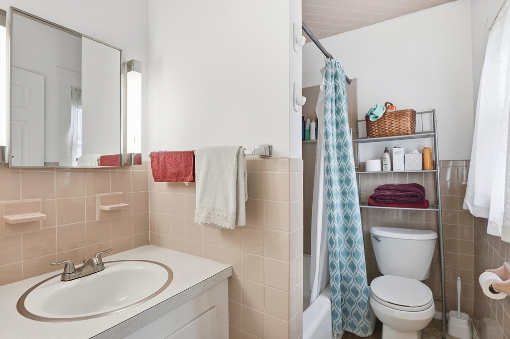 21 Whitman Street Leominster, MA 01453 - Photo 24 of 34 a bathroom with a sink toilet and shower