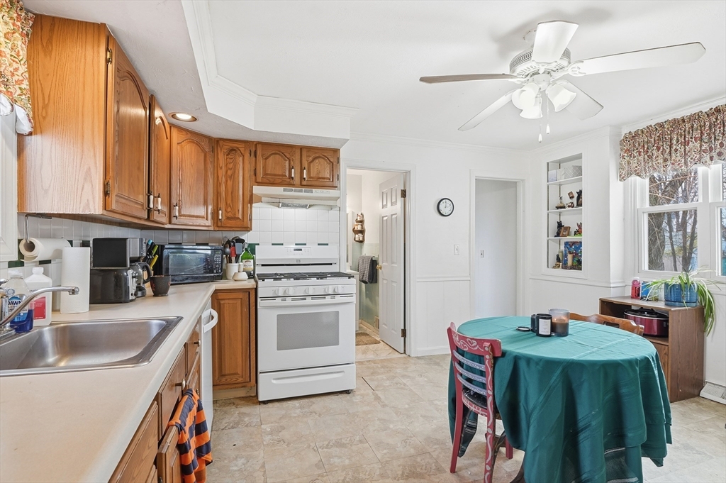 21 Whitman Street Leominster, MA 01453 - Photo 6 of 34 a kitchen that has a sink and a stove top oven