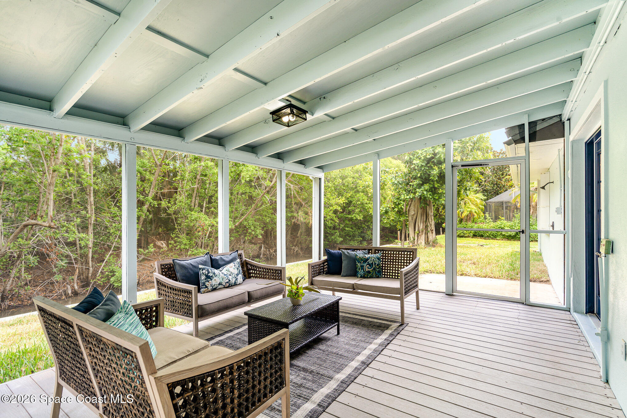 362 Nikomas Way Melbourne Beach, FL 32951 - Photo 22 of 32 a living room with furniture and a large window