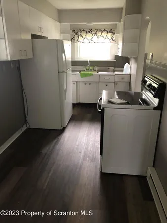 a close view of sink and cabinets