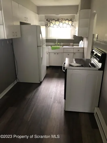 a close view of sink and cabinets