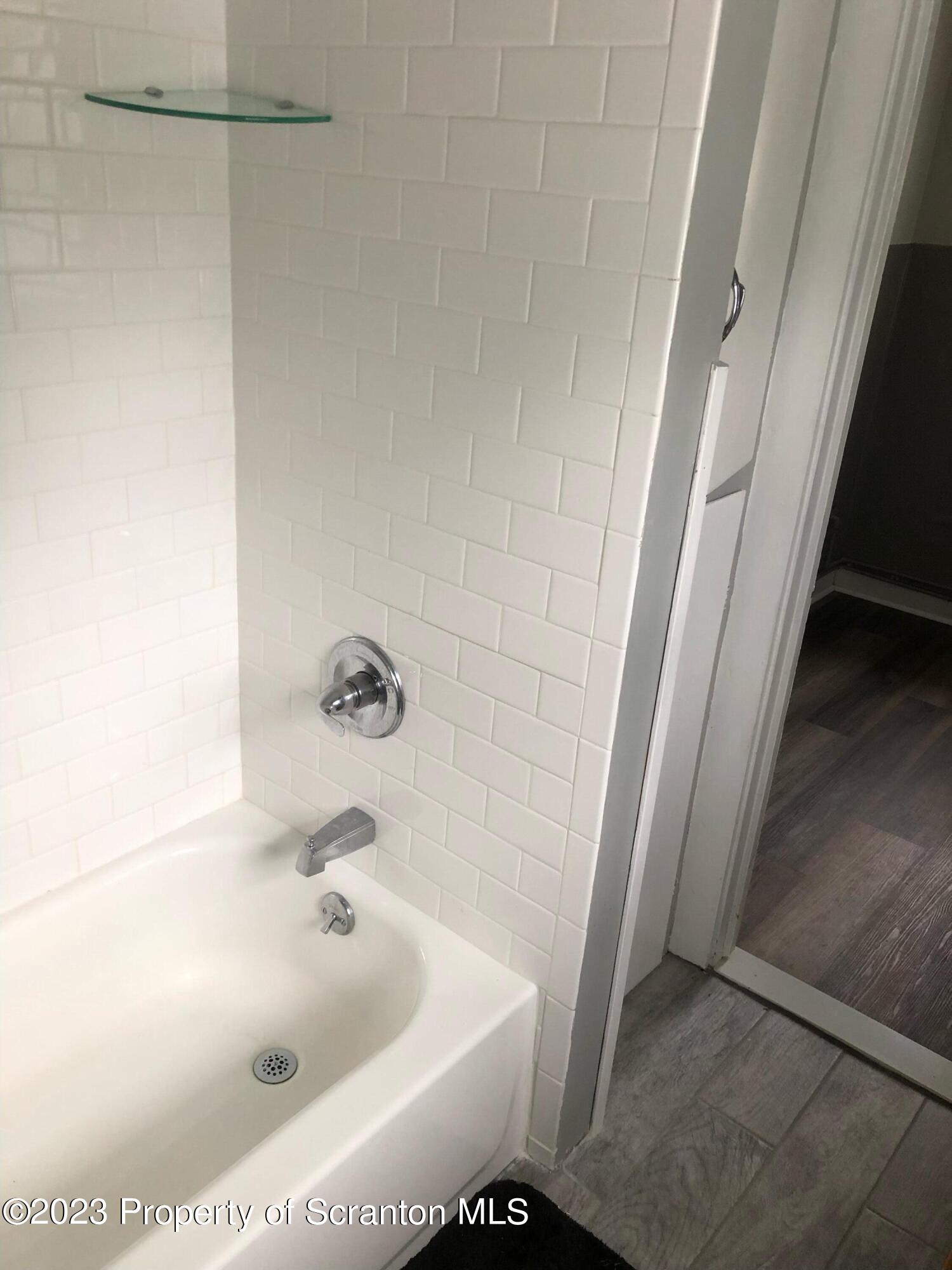 1111 Church Street Jessup, PA 18434 - Photo 8 of 10 a bathroom with a bathtub