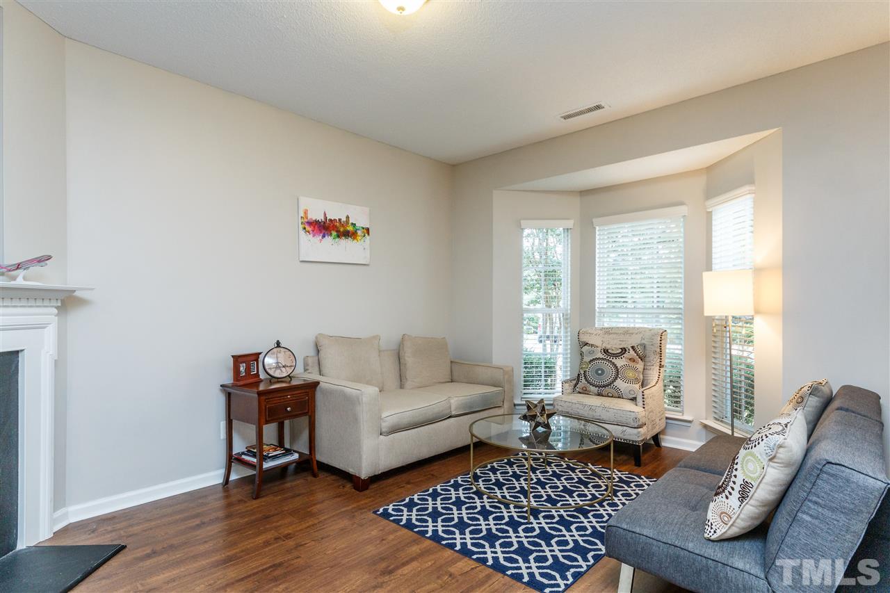 1035 Lake Moraine Place Raleigh, NC 27607 - Photo 2 of 19 a living room with furniture and a window