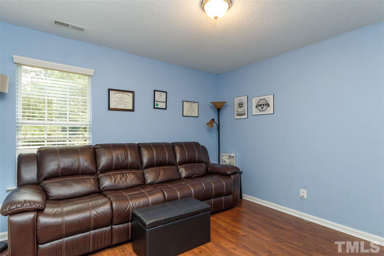 1035 Lake Moraine Place Raleigh, NC 27607 - Photo 12 of 19 a couch sitting in a living room with a couch