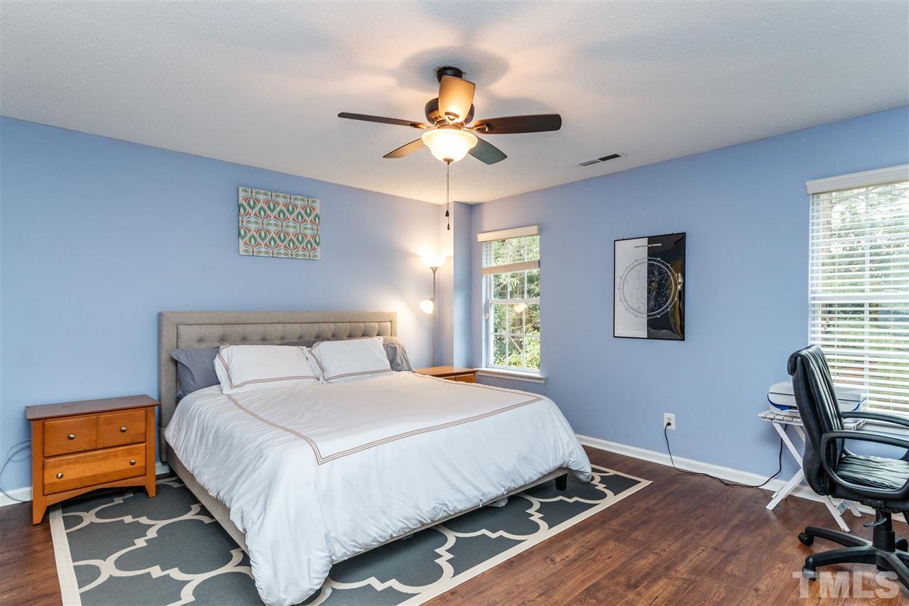 1035 Lake Moraine Place Raleigh, NC 27607 - Photo 9 of 19 a bedroom with a bed and a window