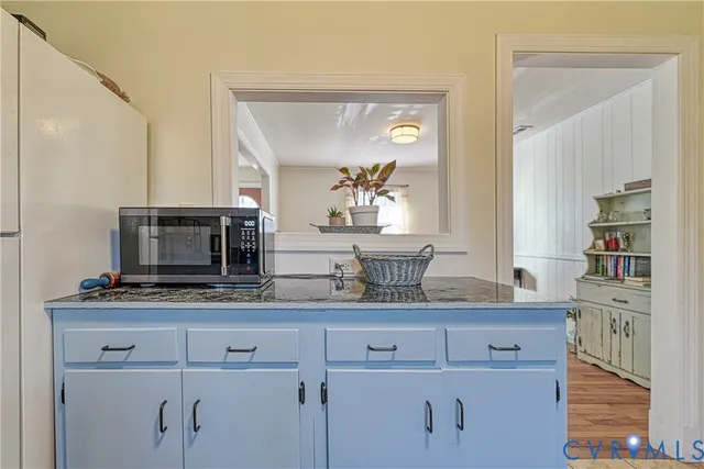 a view of living room with furniture and flat screen tv
