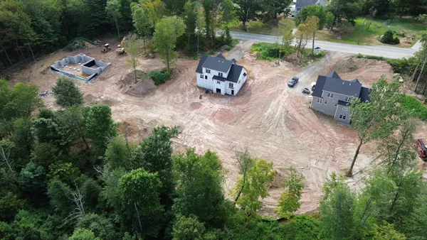 an aerial view of a house with outdoor space