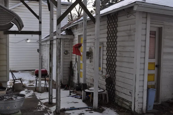 a view of a house with a potted plant