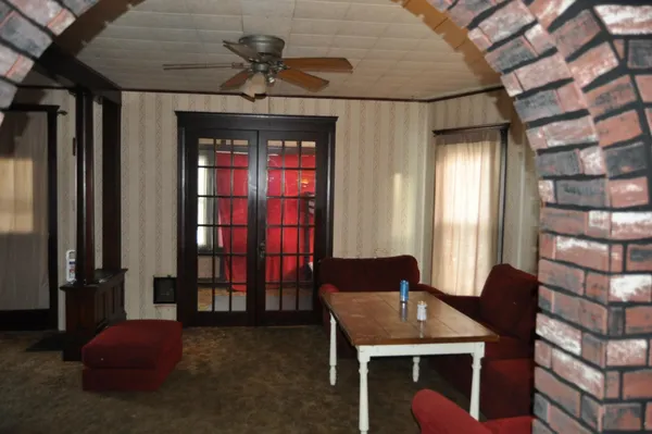 a dining room with a table and chairs