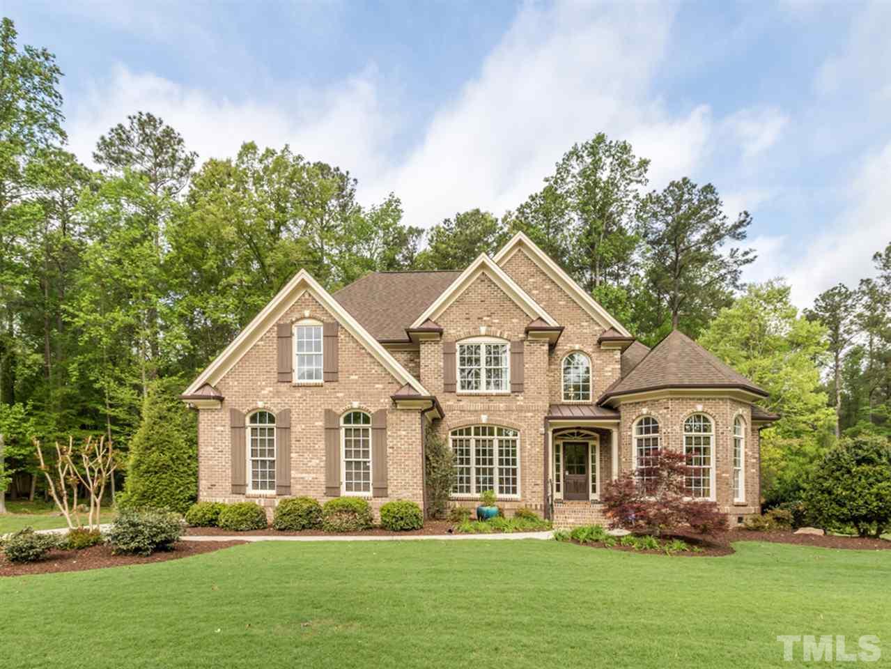 3424 Griffice Mill Road Raleigh, NC 27610 - Photo 1 of 25 a front view of a house with a garden and plants