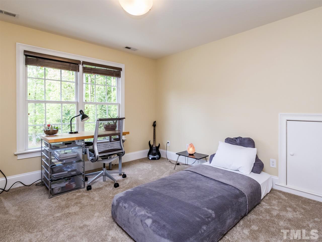 3424 Griffice Mill Road Raleigh, NC 27610 - Photo 18 of 25 a bedroom with furniture and a large window
