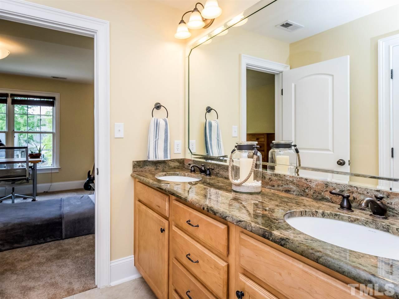 3424 Griffice Mill Road Raleigh, NC 27610 - Photo 19 of 25 a bathroom with a sink double vanity and a mirror
