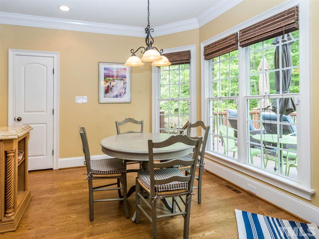 3424 Griffice Mill Road Raleigh, NC 27610 - Photo 8 of 25 a view of a dining room with furniture window and wooden floor