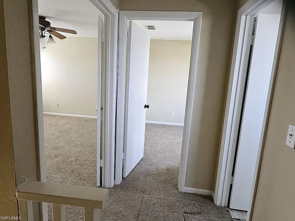 a view of a livingroom from a hallway