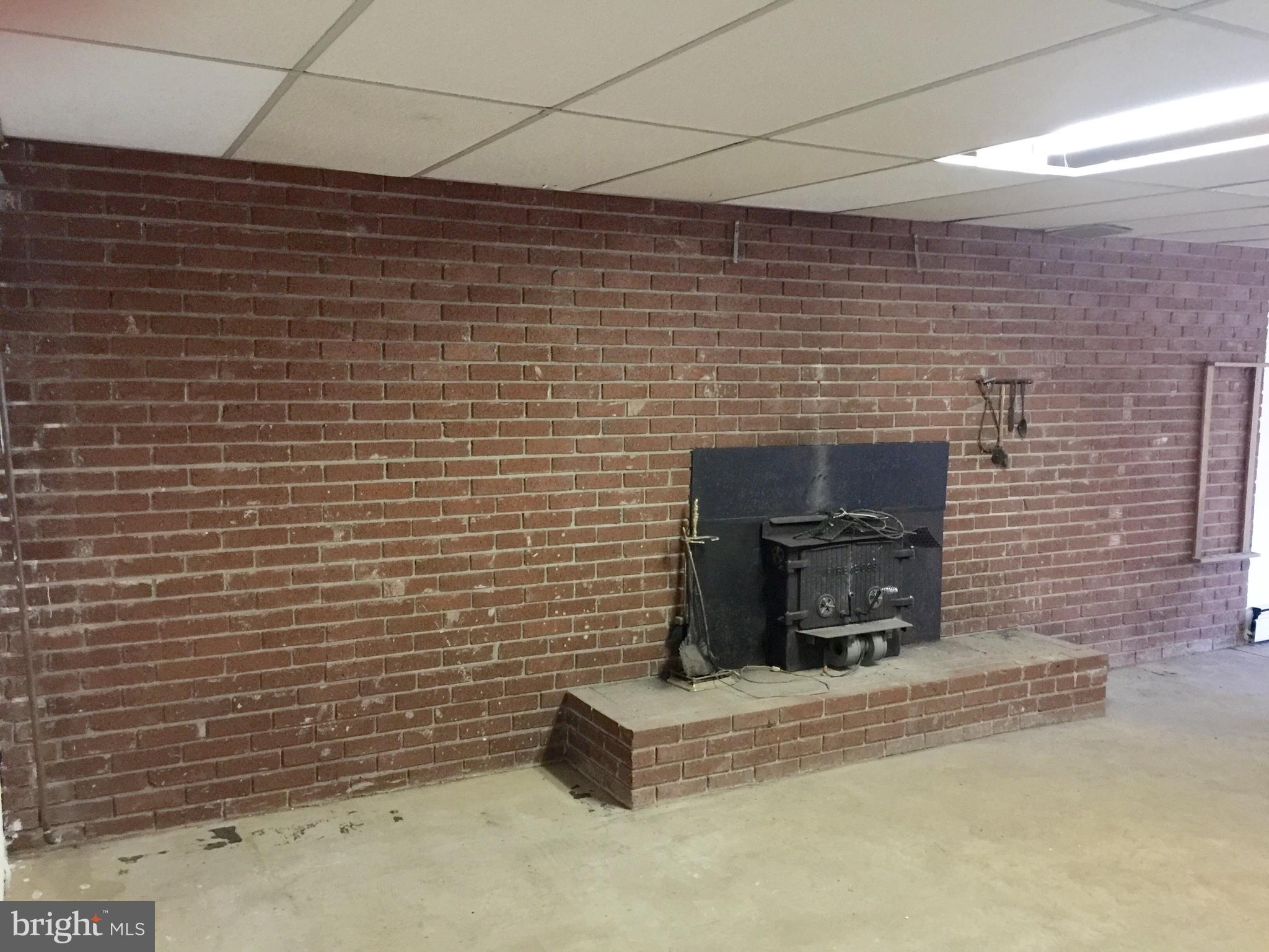 3536 Beckleysville Road Manchester, MD 21102 - Photo 25 of 30 Fireplace and brick wall in basement