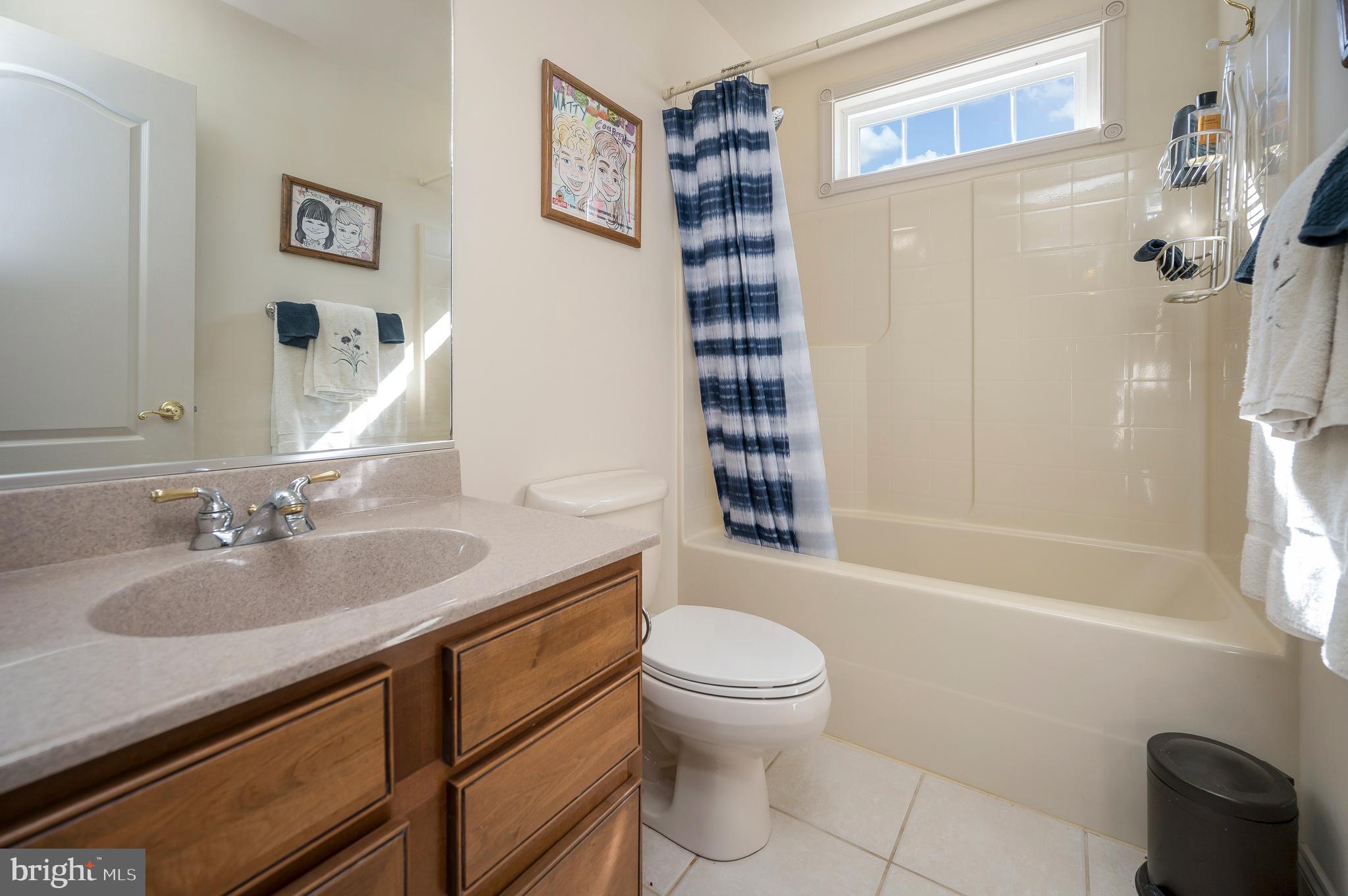 408 Liberty Boulevard Locust Grove, VA 22508 - Photo 17 of 45 a bathroom with a granite countertop sink toilet and shower
