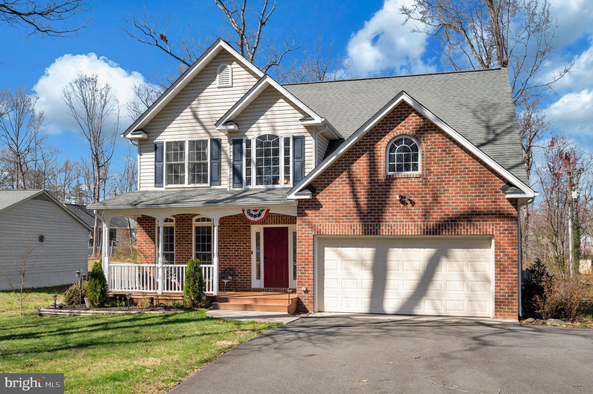 408 Liberty Boulevard Locust Grove, VA 22508 - Photo 2 of 45 a front view of a house with a yard