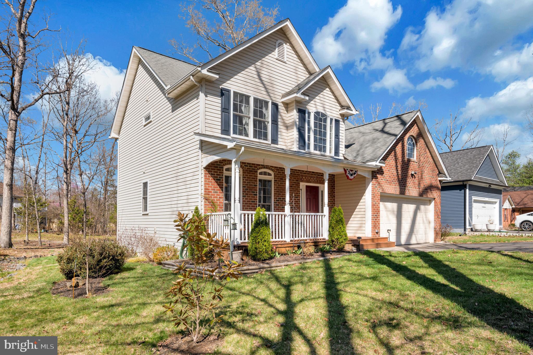 408 Liberty Boulevard Locust Grove, VA 22508 - Photo 3 of 45 a front view of a house with a yard