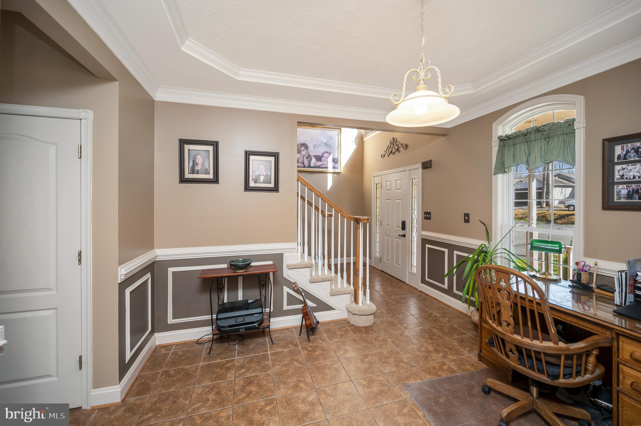 408 Liberty Boulevard Locust Grove, VA 22508 - Photo 5 of 45 a view of a livingroom with furniture and a ceiling fan