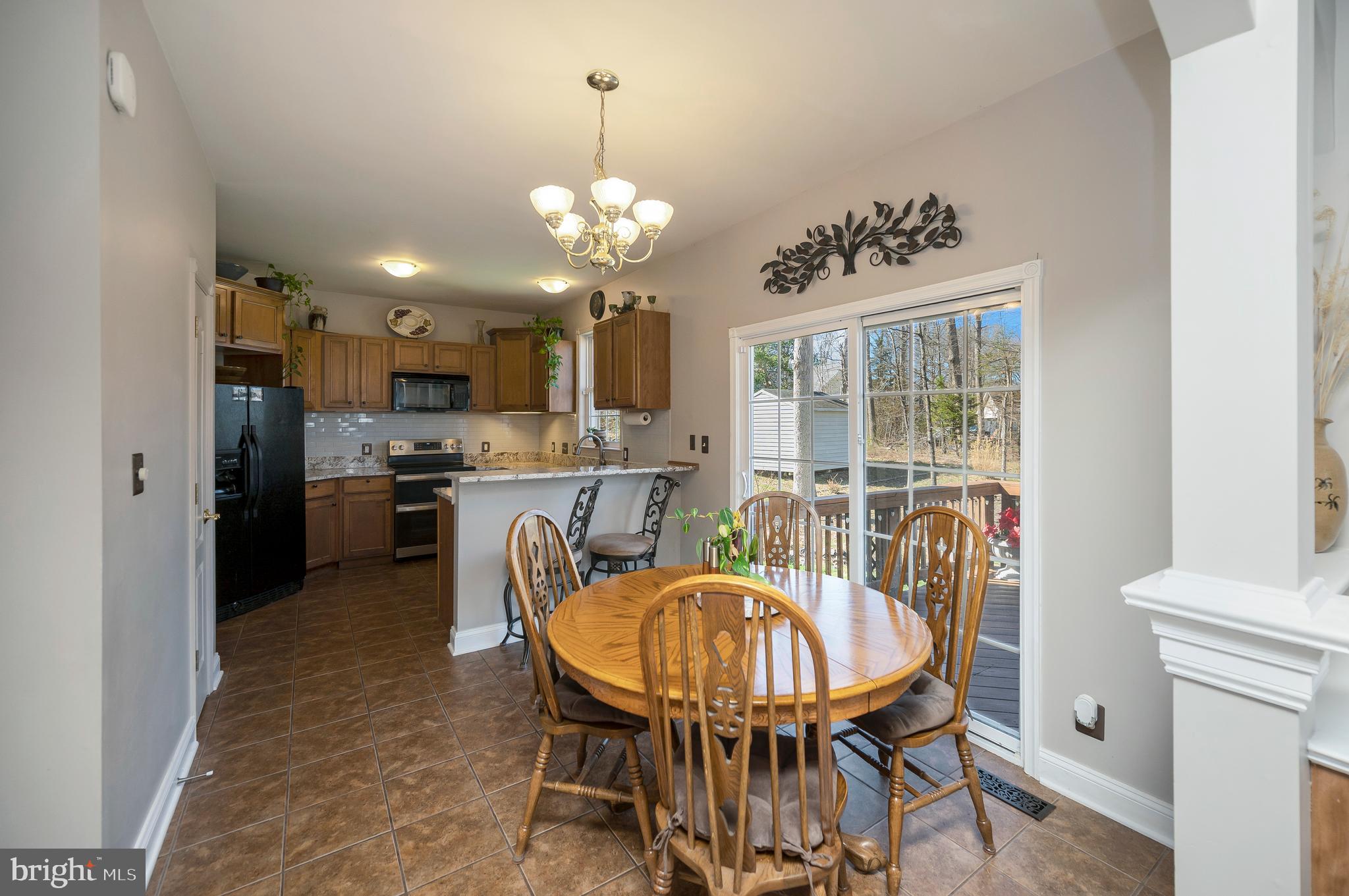 408 Liberty Boulevard Locust Grove, VA 22508 - Photo 8 of 45 a view of a dining room with furniture window and wooden floor