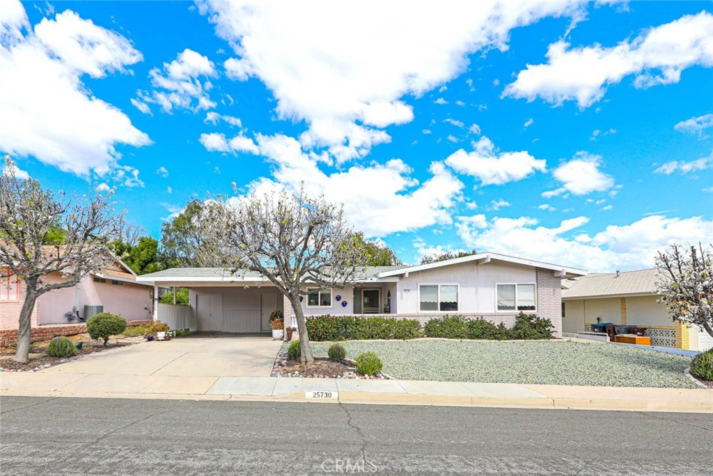 25730 Warwick Road Menifee, CA 92586 - Photo 1 of 1 a front view of a house with a yard and garage