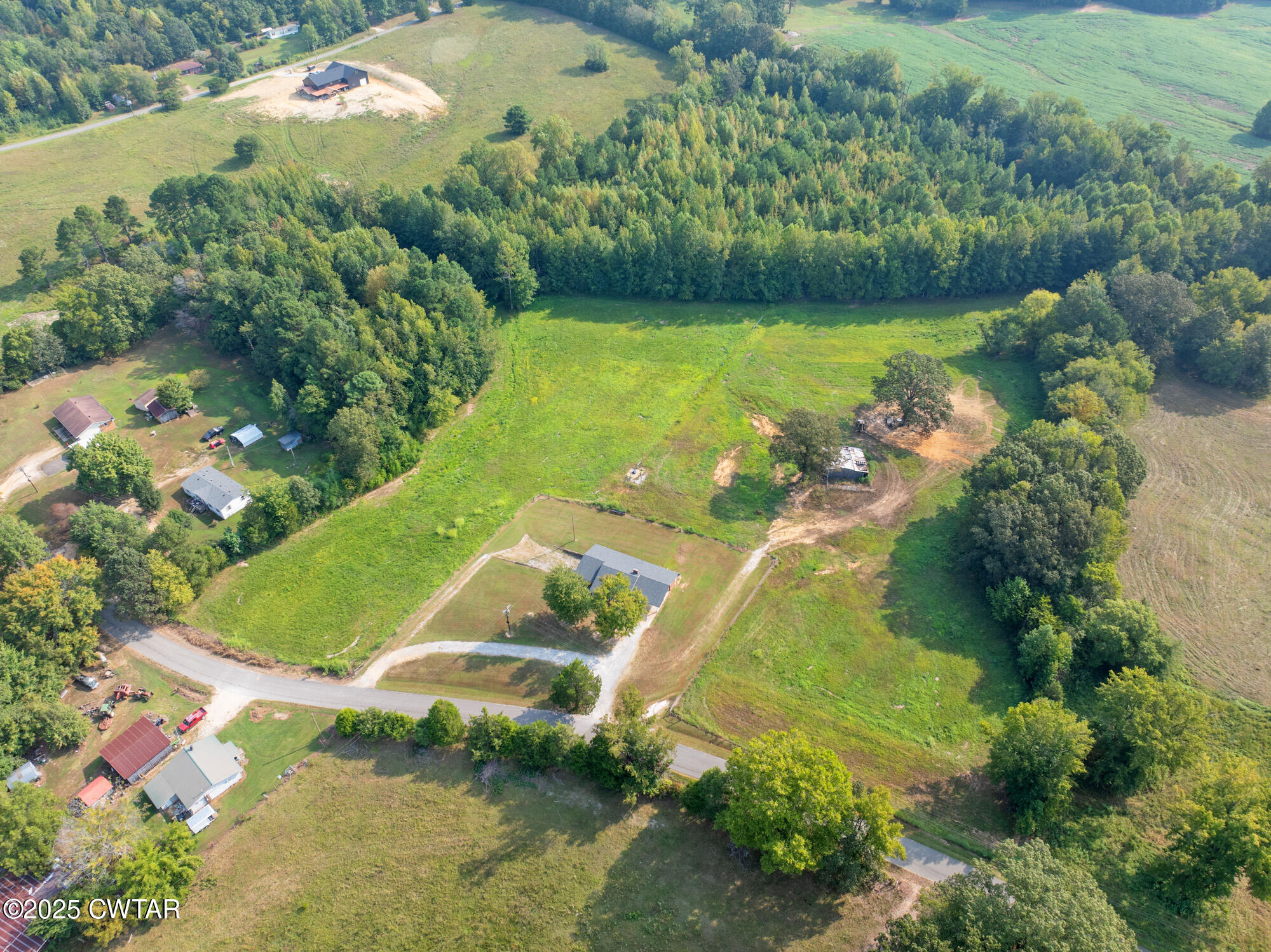 1176 Myracle Town Road Darden, TN 38328 - Photo 11 of 40 an aerial view of a residential houses with outdoor space and trees all around