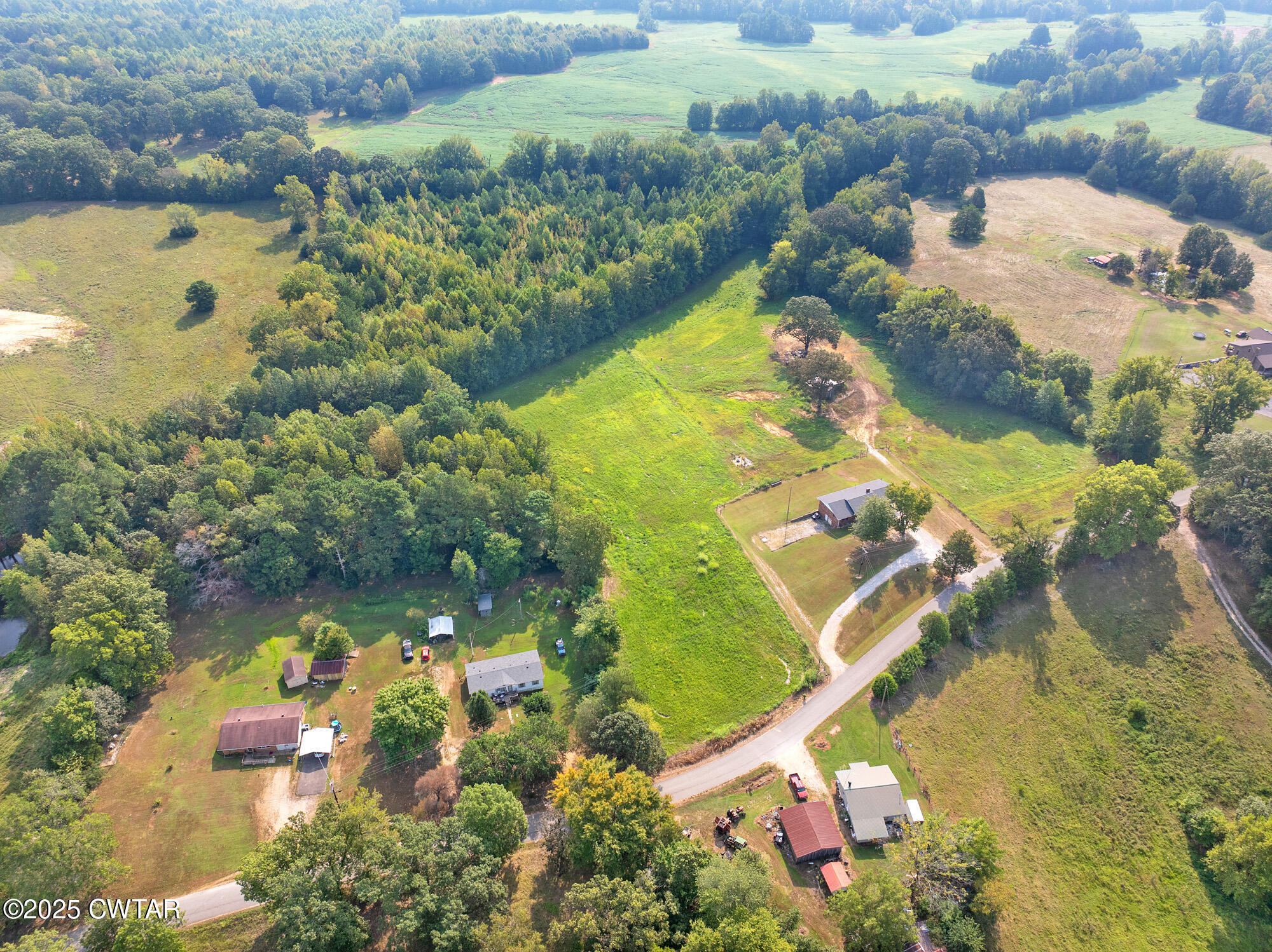 1176 Myracle Town Road Darden, TN 38328 - Photo 12 of 40 an aerial view of residential houses with outdoor space