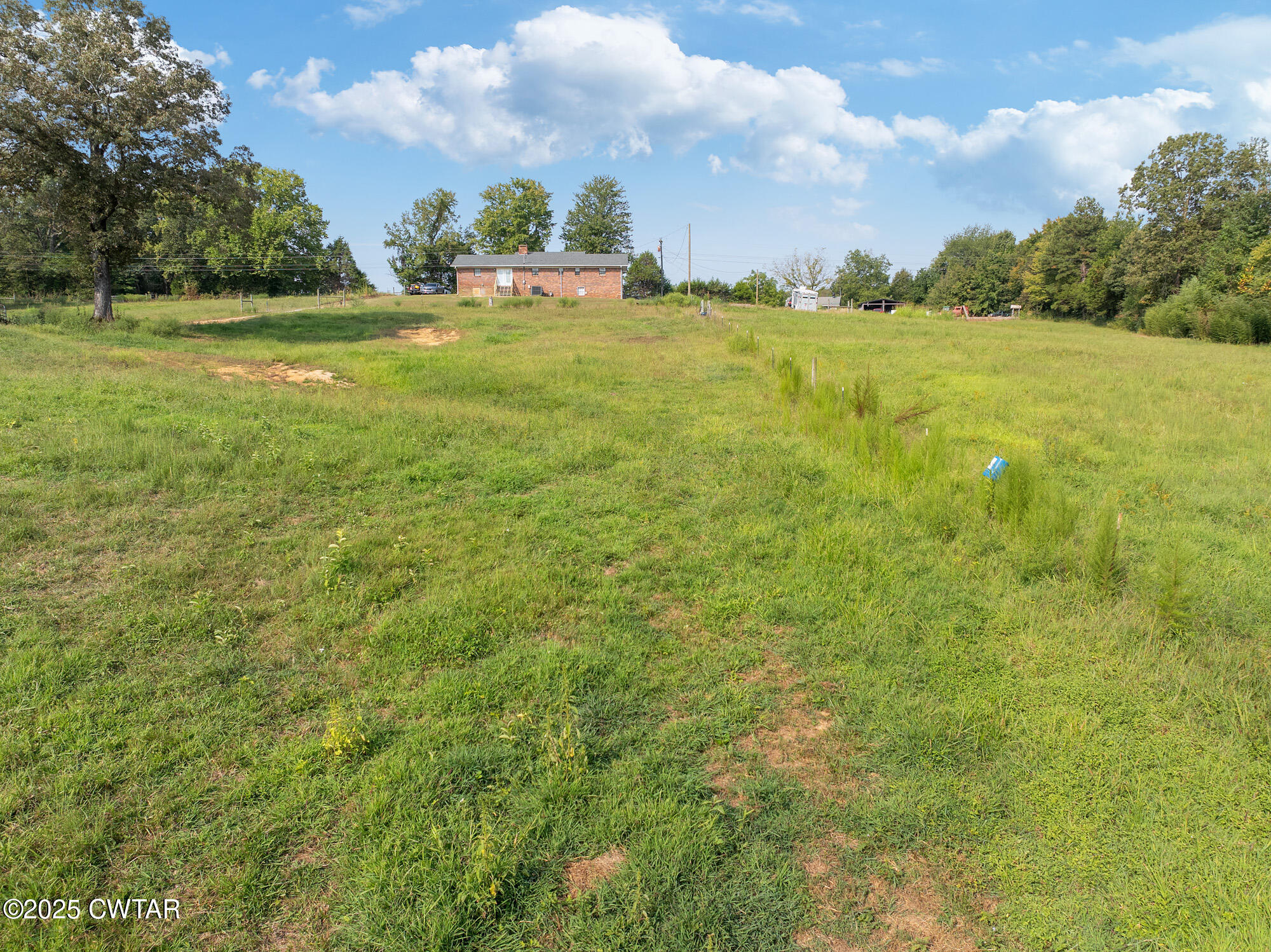 1176 Myracle Town Road Darden, TN 38328 - Photo 17 of 40 a view of a field with an trees