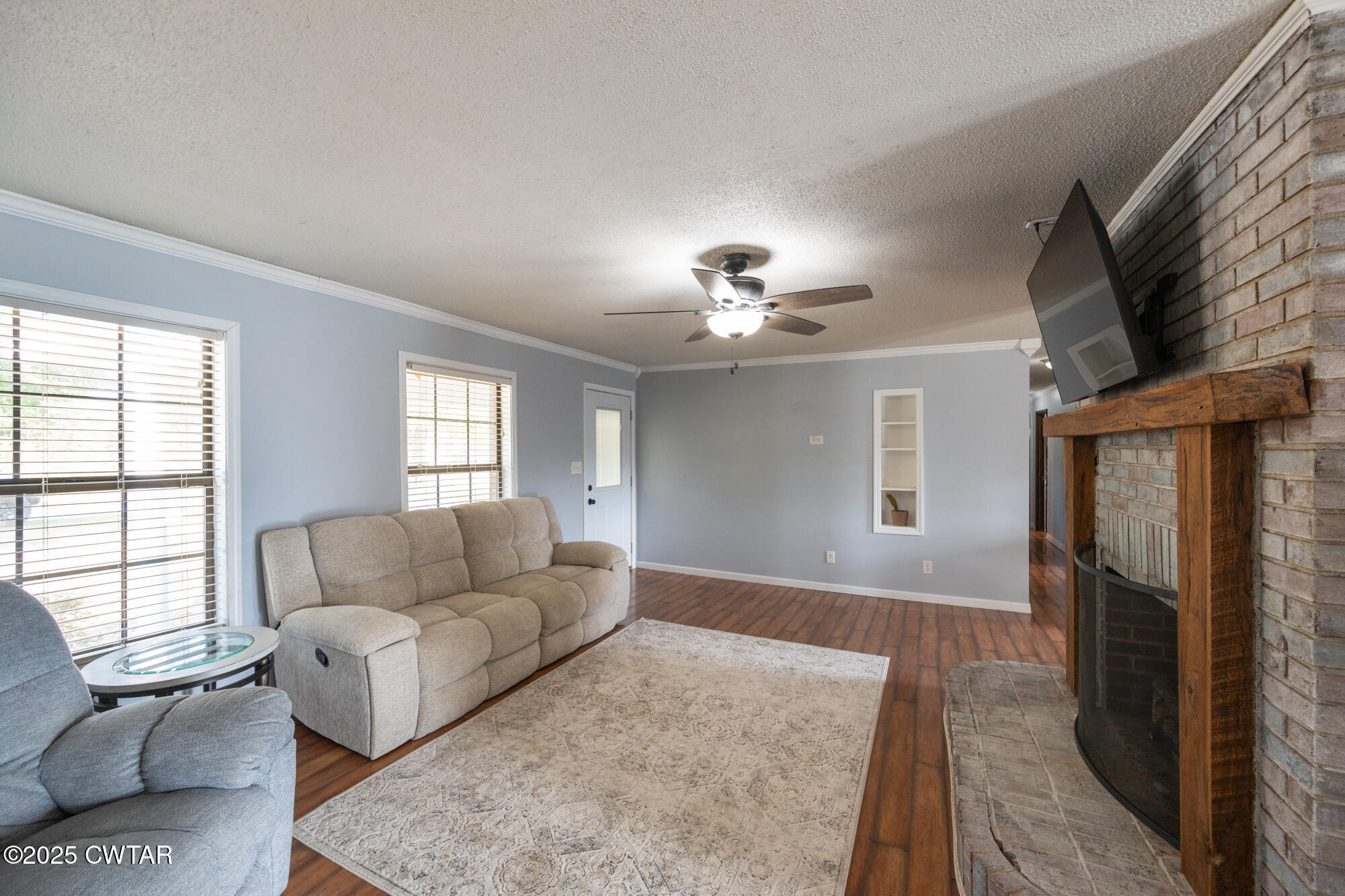 1176 Myracle Town Road Darden, TN 38328 - Photo 20 of 40 a living room with furniture and a flat screen tv