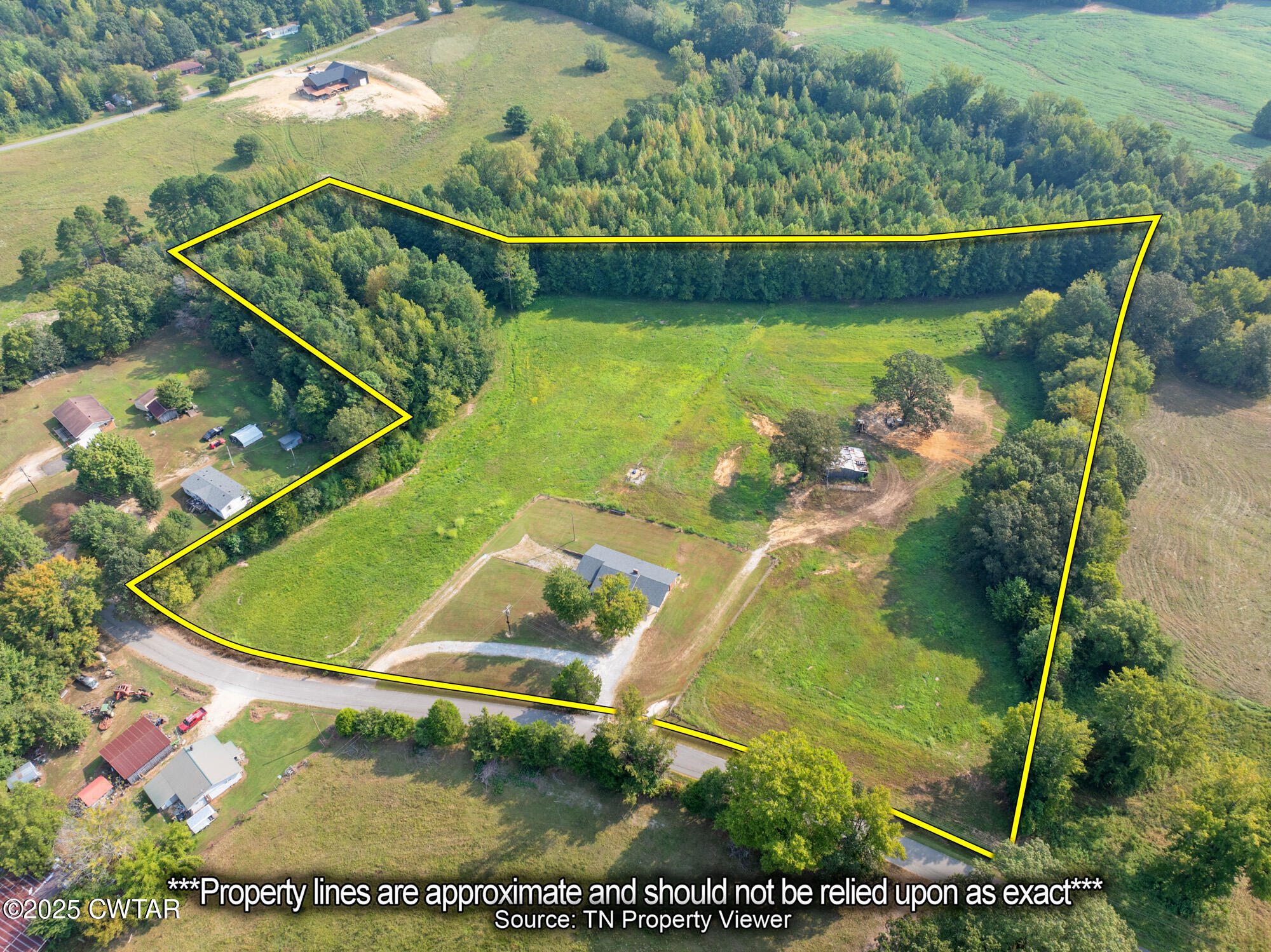1176 Myracle Town Road Darden, TN 38328 - Photo 2 of 40 an aerial view of a residential houses with outdoor space