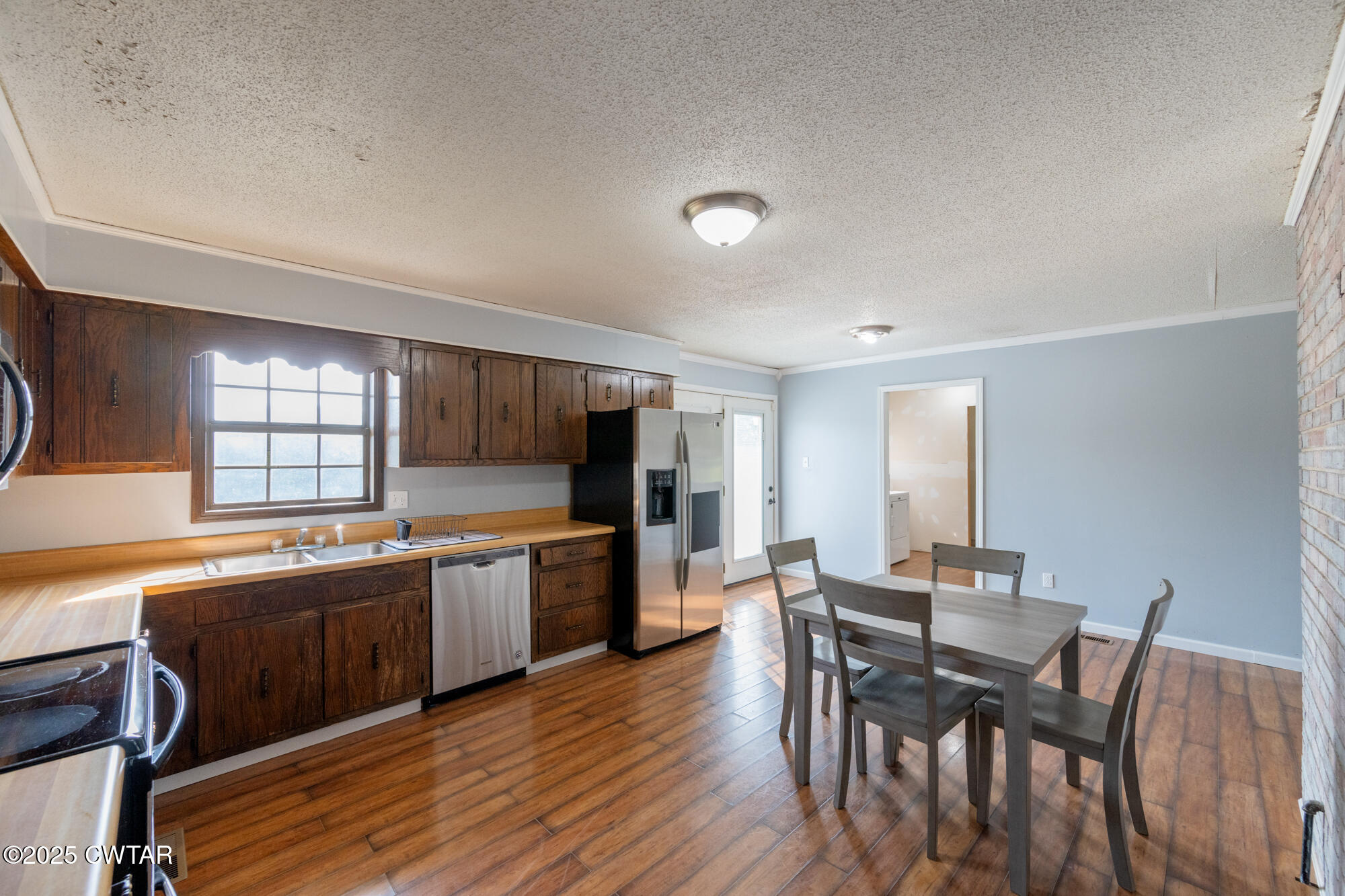 1176 Myracle Town Road Darden, TN 38328 - Photo 23 of 40 a kitchen with a table and chairs in it