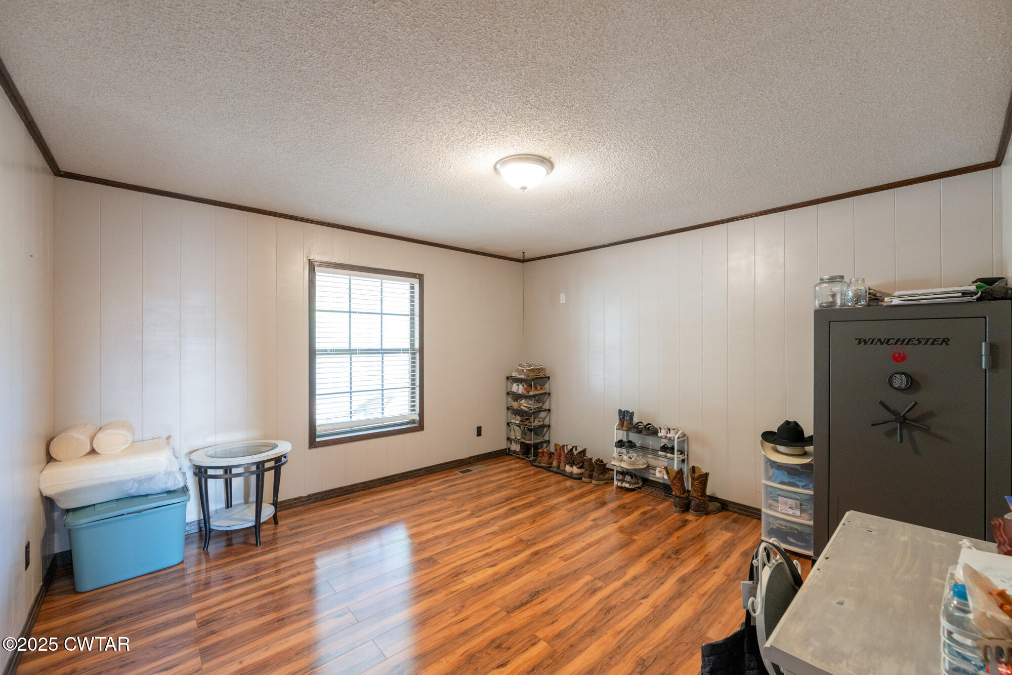 1176 Myracle Town Road Darden, TN 38328 - Photo 27 of 40 a room with furniture and a wooden floor